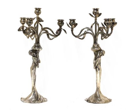 A matched pair of WMF silvered four-branch figural candelabra,each modelled and cast as an Art Nouveau maiden holding a vase 