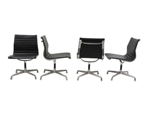 Seven 'EA105' office chairs, designed by Charles and Ray Eames for Herman Miller, each with a leather seat and fixed base, ca