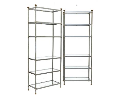 A pair of nickel and brass étagères,1970s, probably French, each with six glass shelves, with brass finial capitals, 80.5cm w