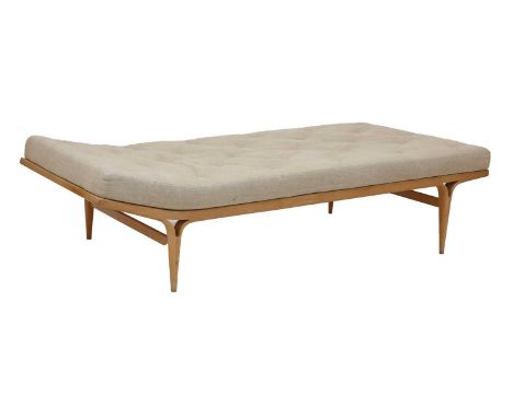 A Swedish 'Berlin 57' beech daybed,designed by Bruno Mathsson for Firma Karl Mathsson, with a beige fabric seat with leather 