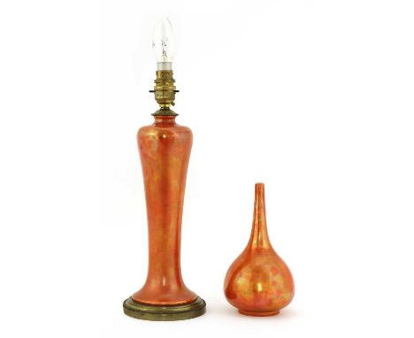 A Ruskin Pottery orange lustre table lamp, of tall baluster form, mounted with a fitting and fixed plinth, 35.5cm high, and a