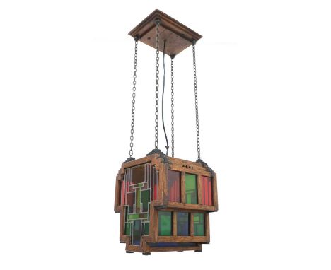 An Haagse Art Deco oak hanging light,1930s, Dutch, the shade of stepped form with multicoloured glass panels, 29cm wide28cm d