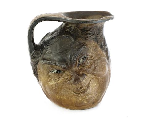 A Martin Brothers stoneware double face jug,incised '12-1913 R W Martin Bros London Southall',13.5cm highCondition report: Tr