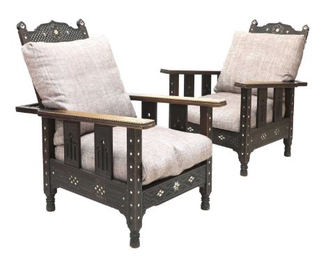 A pair of Syrian mahogany and mother-of-pearl inlaid armchairs,c.1900, each frame carved and inlaid with crescents, stars, an