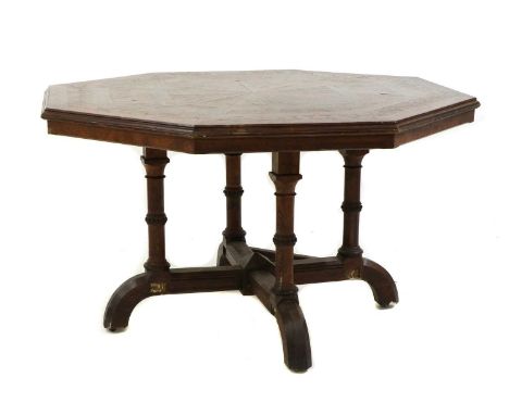 A Howard &amp; Sons oak octagonal centre table,c.1880, in a 'reformed Gothic' style, having an octagonal parquetry top, on ri