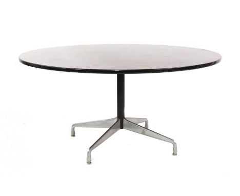 A circular rosewood table, §designed by Charles and Ray Eames for Herman Miller, 153cm diameter73.5cm highA10 no. 611463/01Fr