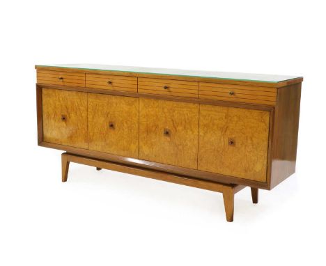 A Lebus Furniture teak sideboard,1960s, possibly retailed by Heal's, with a rectangular teak top over four parallel drawers, 