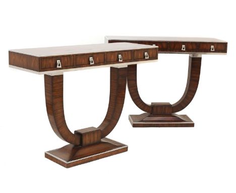 A pair of Indian rosewood and chrome console tables,by Theodore Alexander, each rectangular top above two frieze drawers, rai