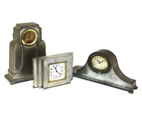 Three Art Deco pewter mantel clocks,two stamped 'Tudric Pewter' and numbered, 15cm wide and 26.5cm wide, and another clock, s