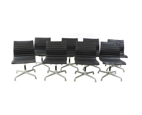 Eight 'EA105' office chairs, designed by Charles and Ray Eames for Herman Miller, each with a leather seat and fixed base, ca
