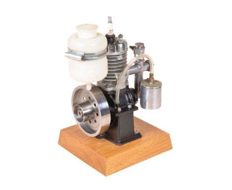 A well-engineered model of a single cylinder air cooled internal combustion engine, fitted with carburetor, fuel tank and spa