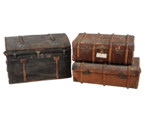 Two vintage leather travelling trunks, and large dome top trunk.