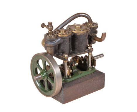 A vintage model of a live steam compound two cylinder vertical engine, the cylinders supported on four columns with open cran