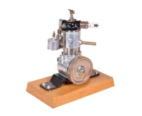 A well-engineered model of an internal combustion stationary engine, with fitted carburetor and large ignition plug. the mode