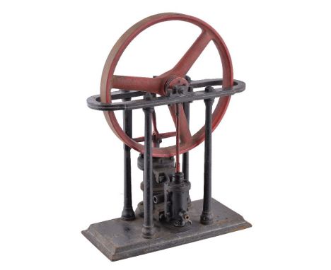 An early 20th Century model of an over-type live steam engine, the over-type crank and 27cm spoked flywheel supported on shap