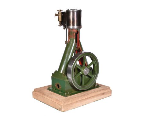 A well-engineered model of a vertical live steam stationary engine, the single lagged cylinder with polished brass displaceme