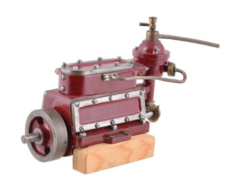 A well-engineered and unusual model of a three cylinder live steam enclosed crank marine engine, the cylinders of ¾” stroke b