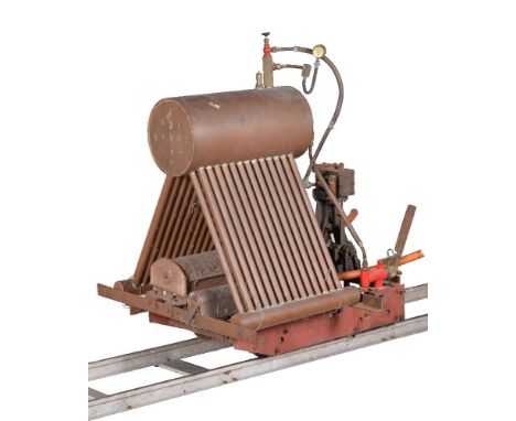 A 7 1/4 inch gauge bogie type locomotive, being chain driven with a Stuart Turner 7a vertical live steam engine having trunk 