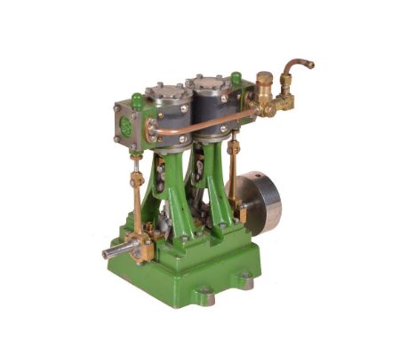 A model of a Stuart Turner D10 vertical marine engine, having metal clad cylinders supported on trunk guides with eccentric d