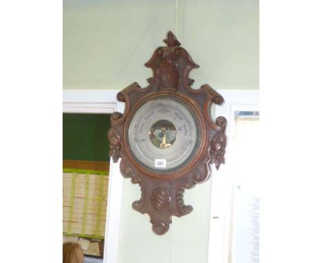 Victorian carved oak barometer, signed H. Thompson, 16 Gillies St., London