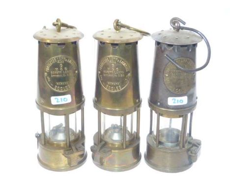 Three miners lamps by Protector Lamp Lighting Co.