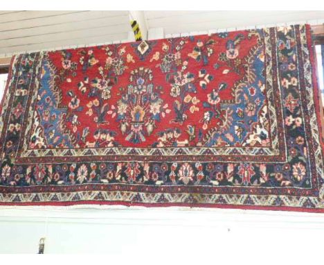 Red ground Persian design carpet 3.42 x 2.14