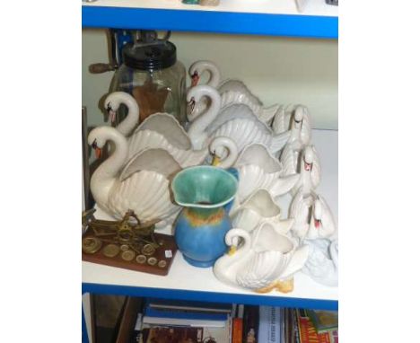 Collection of pottery swans, butter churn, Beswick jug and postal scale and weights