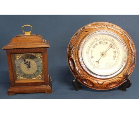 Small Georgian style bracket clock in mahogany case, movement marked Rotherham Made in England and carved oak framed aneroid 
