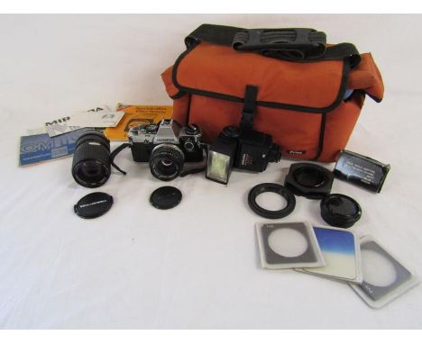 Olympus OM10 camera with Olympus Zuiko lens, Miranda 700cd flash, Bell &amp; Howell 5500361 lens, carry bag etc