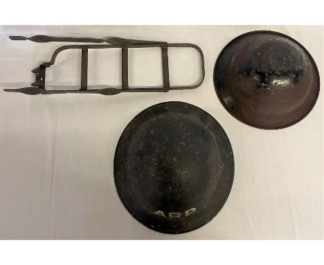 WWII cycle carrier dated 1945, WWII child's steel helmet and a WWII ARP helmet appears marked F&amp;L 87 1/1940