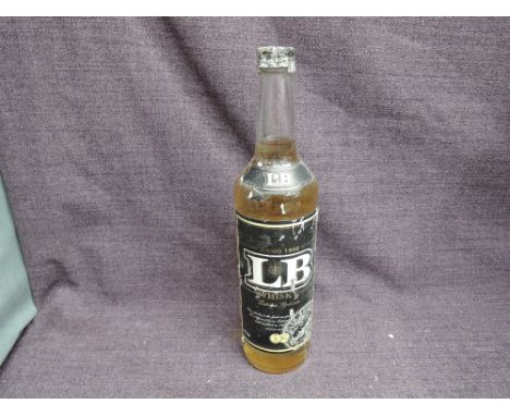 A bottle of LB Latvia Whisky, The label reads: this whisky is the first one produced in Latvia. It is obtained from Latvia ry