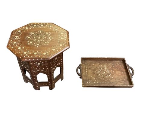 A modern Eastern style octagonal inlaid folding occasional table, diameter 41cm, with matching twin handled rectangular tray,
