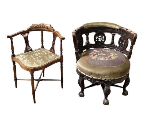 A late Victorian heavily carved oak six legged tub chair, with floral tapestry seat, and an Edwardian mahogany, inlaid and cr