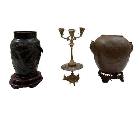 A 19th century Chinese bronze vase, decorated with birds amidst scrolling foliage, (af), raised on carved hardwood stand, hei