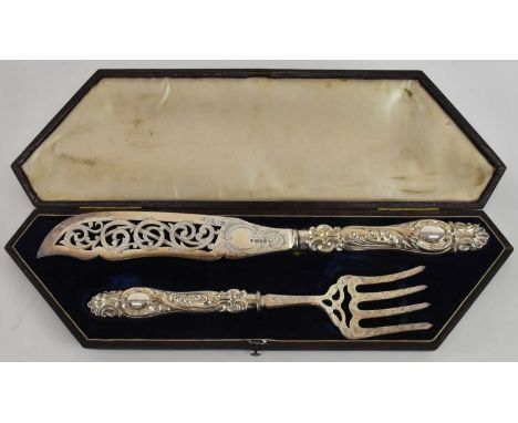 AARON HATFIELD &amp; SONS; a cased pair of Victorian hallmarked silver fish servers, both with filled handles, length of knif