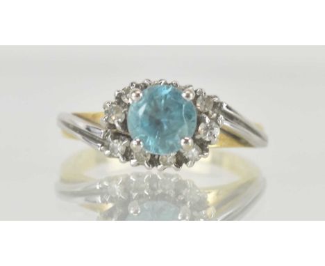An 18ct gold topaz and diamond set ring, with white gold embellished crossover shoulders, size J, approx 4.15g.