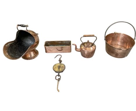 An early 20th century copper coal scuttle, with ebonised handles, height 41cm, a copper kettle, copper bucket with swing loop