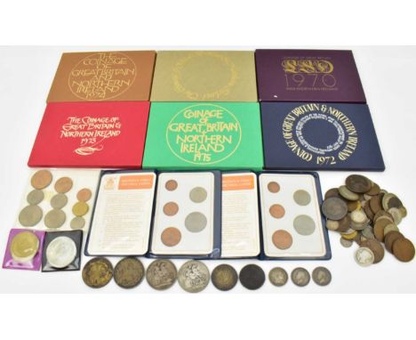 A collection of UK coins, including Victoria 1889 and 1895 silver crowns, a 1935 rocking horse crown and a 1937 Commonwealth 