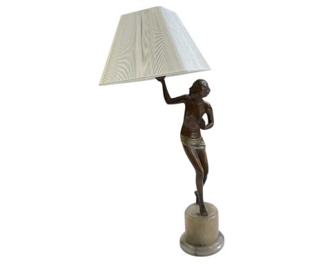 A reproduction Art Deco style bronze figural table lamp, raised on onyx base, height to top of fitment 48cm, with white shade