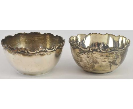 WALKER &amp; HALL; a pair of Edward VII hallmarked silver circular bowls, Sheffield 1907, both diameter 10cm, combined weight
