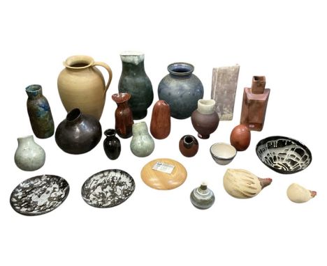A collection of twenty-two items of studio pottery and glass, including a small black glass vase by Julia Navais, height 14.5