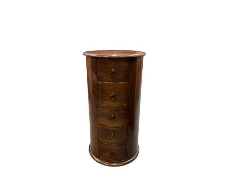 A reproduction stained pine cylinder type five drawer bedside table, height 87cm, diameter of top 48cm.