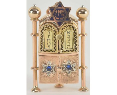 A 14ct yellow gold Judaica pendant, modelled as a Torah shrine, with set of four hinged doors, enclosing a fitted interior, w