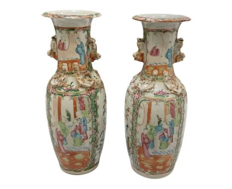 A pair of late 19th century Chinese Canton Famille Rose baluster form porcelain vases, both height 31cm (2).