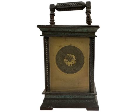 A late 19th/early 20th century French brass cased carriage clock, the bronzed dial set with Arabic numerals, height 10.5cm, w