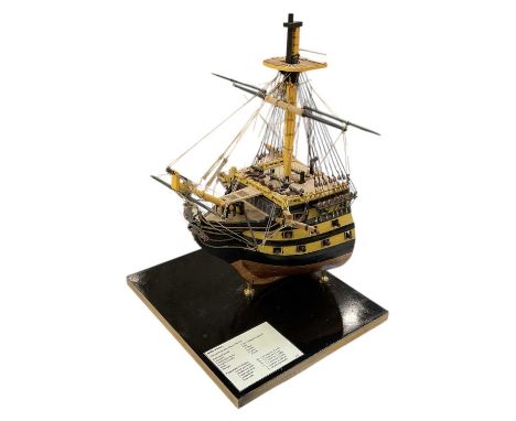 A modern kit built cross-section model of 'HMS Victory', mounted on modern wooden plinth base, height approx 48cm.