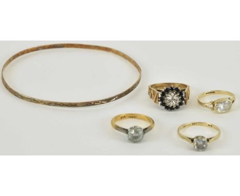 A 9ct gold illusion set diamond and sapphire cluster ring with textured shoulders, size N, approx 4.9g, a 9ct gold bezel set 