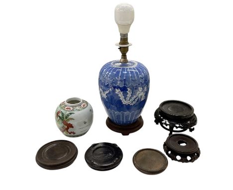 An early 20th century Chinese Famille Rose porcelain ginger jar, raised on carved hardwood stand, with four character mark to