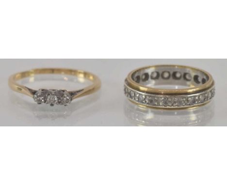 A yellow metal diamond three stone ring, size M, and a yellow metal and white stone full eternity wedding band, size I, appro