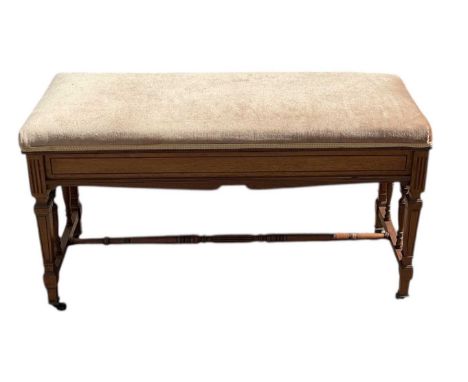 An early 20th century Edwardian mahogany duet piano stool, with hinged lid, width 90cm.